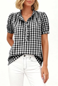 Detailed view of women's gingham short sleeve shirt with ruffle trim and stand collar