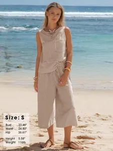 Detailed size chart overlay for striped cotton two-piece set on a beach background