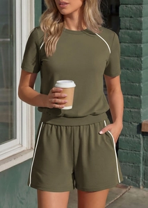 Detail view of army green summer lounge set showing white side stripes and side pockets