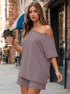 Detailed close-up of soft knit fabric on a stylish two-piece mauve leisure set for women