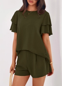 Detailed close-up of dark green seersucker fabric and ruffled sleeves on a summer set