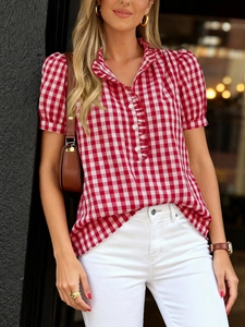 Detail of red gingham short sleeve shirt with ruffle stand collar and puff sleeves