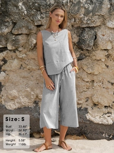 Detailed outdoor shot of grey striped sleeveless top and cropped wide-leg pants
