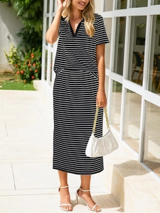 Fashionable black and white striped two-piece set featuring polo shirt and midi skirt