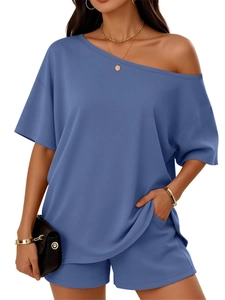 Detail view of steel blue two-piece lounge set with one-shoulder top and pocket shorts