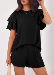 Close-up of black summer set showing crinkle fabric texture and ruffle sleeve details