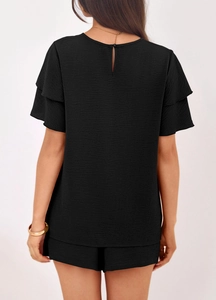 Detail view of black summer set showing back water-drop cutout and ruffled sleeves