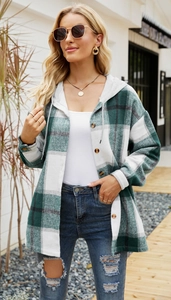 Detail of green and white plaid hooded shirt jacket with drawstrings and button closure