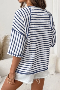 Close-up of women's blue and white striped crepe fabric t-shirt showing back texture