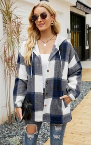Outdoor shot of a blue and grey plaid hooded coat with a single-breasted button design
