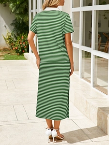 Rear view of green and white striped two-piece set with a side-slit midi skirt