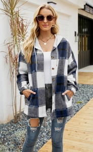 Detail of plaid hooded shacket with buttons and classic blue checkered wool texture