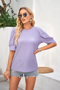 Detail of lavender eyelet embroidery and puff sleeves on casual round neck summer top