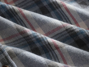 Detail of blue and red plaid flannel fabric texture with soft cotton weave and pattern