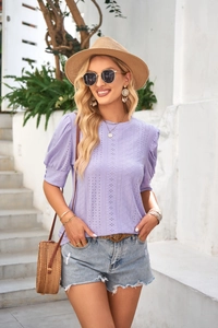 Close-up of lavender eyelet embroidery top with vintage puff sleeves and hollow texture