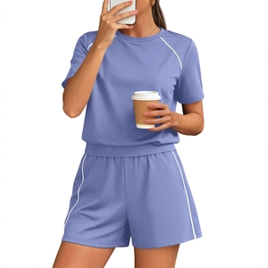 Women's two-piece sports set with crewneck t-shirt and drawstring shorts in lilac purple
