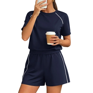 Women's navy two-piece tracksuit with crew neck shirt and drawstring shorts and white stripes