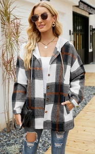 Detail of hooded plaid jacket with soft flannel texture and caramel checkered pattern