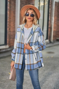 Close-up of women's hooded plaid jacket with classic blue and brown oversized check pattern