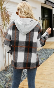 Rear view of an oversized plaid hooded jacket with grey hood and orange check details