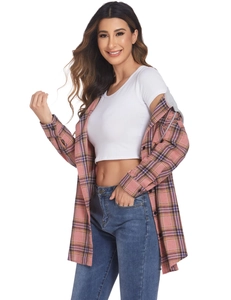 Detail of a casual women's hooded plaid shirt with pink patterns and blue denim jeans