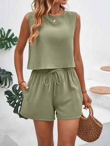 Detail of olive green summer set showing ribbed crop top and drawstring shorts with pockets