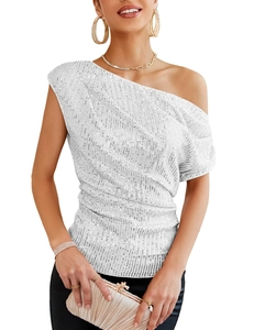 Detailed close-up of white sequin one-shoulder top with pleated texture and shimmer