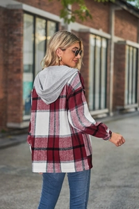 Close-up of red plaid hooded jacket fabric showing soft texture and high-quality stitching