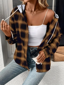 Detail of a brown plaid hooded shirt featuring high-quality flannel and drawstring