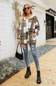 Detail of hooded plaid shacket with khaki checkered pattern and button closure