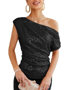 Detail of shimmering black sequins on a one-shoulder women's top for party wear