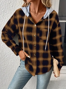 Detail of the brown plaid flannel hoodie jacket with front buttons and chest pocket