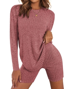 Detail view of pink ribbed knit long-sleeve top and slim biker shorts matching set