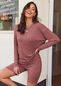 Detailed view of dark pink ribbed knit lounge set featuring long sleeves and fitted shorts