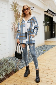 Close-up of a blue and brown plaid hooded flannel shirt jacket with button-front and pockets