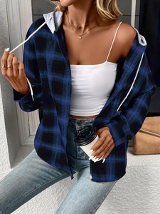 Detail of blue and black plaid hooded shirt with soft flannel texture and drawstring