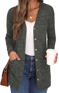 Detailed texture of dark green knit cardigan featuring wooden buttons and side pockets