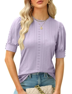 Detail of lavender pointelle knit top featuring decorative buttons on puff sleeves