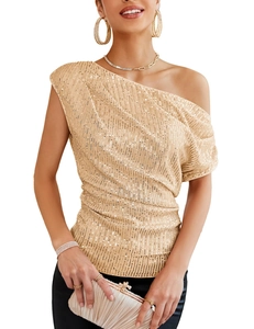 Detail of light gold sequin one-shoulder top with elegant side gathering and waist ruffles