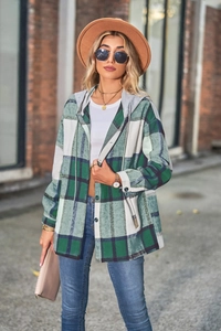 Close-up of women's hooded plaid shirt jacket in green and white brushed flannel fabric