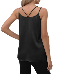 Detail of elegant cross-back straps on a black satin camisole with a smooth silky finish
