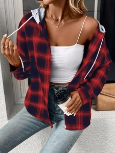 Close-up of a women's red and black plaid hooded shirt jacket with a grey drawstring hood