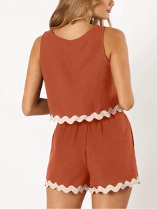 Rear view of two-piece linen set featuring scalloped trim in caramel brown color