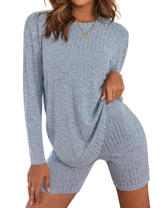 Detail showing high-quality rib-knit texture on long-sleeve top and cycling shorts set