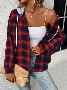 Detailed texture of red and black buffalo plaid shirt jacket with grey drawstring hood