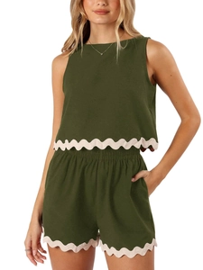 Detailed view of women's olive green summer set featuring white scalloped lace trim