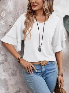 Detail of white V-neck T-shirt with layered ruffle sleeves and lightweight fabric texture