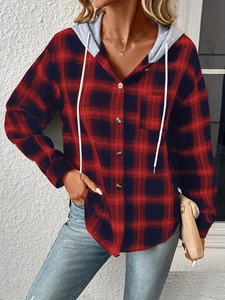 Detail of red and blue checkered plaid hoodie shirt with buttons and white drawstrings