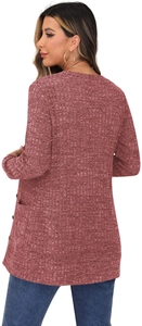 Detail view of pink waffle knit cardigan featuring side pockets and button trim