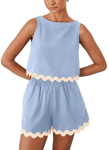 Close-up of light blue linen two-piece set with white wavy scallop edge trim detail